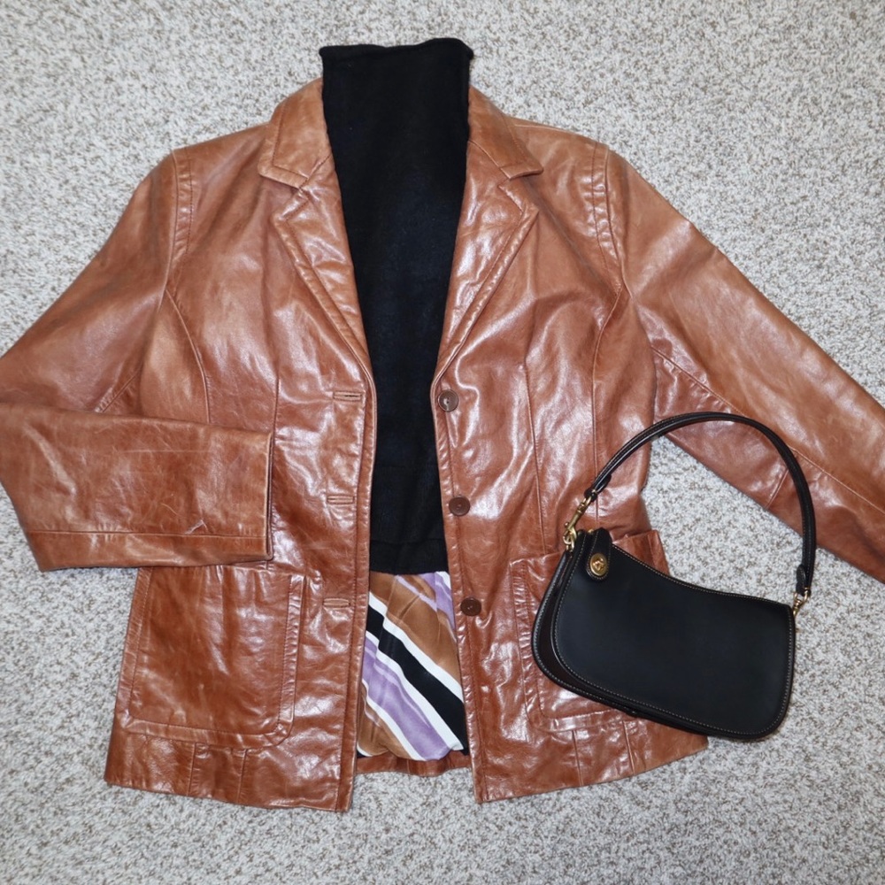 Brown 100% genuine leather jacket. Wilson’s & Pelle Studio.